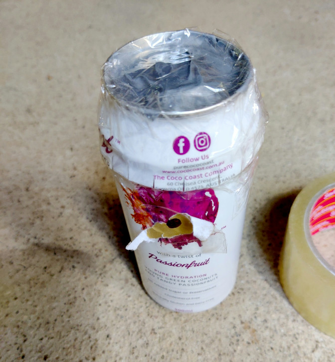A coconut water can, cut and rejoined with sticky tape