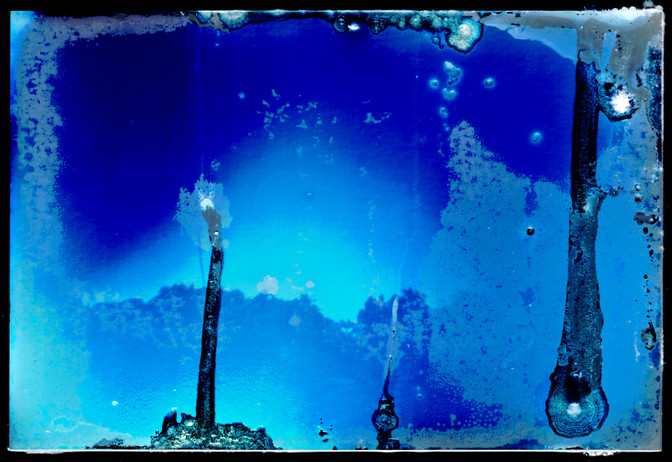 A photograph with barely recognizable subjects, damaged by water
